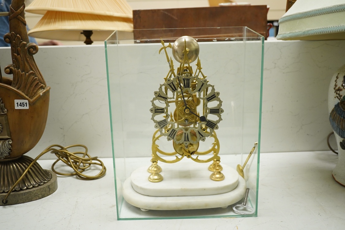 A brass framed skeleton clock, with white marble stand, in glass case, case 39.5cm high